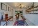 Open concept dining area with a view into the living room and kitchen at 140 Meadowlark Dr, Safety Harbor, FL 34695
