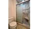 Walk-in shower with checkered floor and built-in seat at 1504 Mission Hills Blvd # 19C, Clearwater, FL 33759