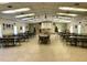 Large community room with tables and chairs, perfect for gatherings at 1504 Mission Hills Blvd # 19C, Clearwater, FL 33759