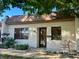Front view of charming condo with landscaping at 1504 Mission Hills Blvd # 19C, Clearwater, FL 33759