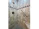 Walk-in shower with tiled walls and a built-in seat at 1504 Mission Hills Blvd # 19C, Clearwater, FL 33759