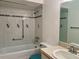 Clean bathroom with tub and shower, a sink, and a mirror at 1504 Mission Hills Blvd # 19C, Clearwater, FL 33759