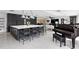 Large kitchen island with seating, dark cabinetry, and a view into the living room at 2599 W Bay Isle Se Dr, St Petersburg, FL 33705