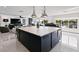 Modern kitchen with large island and expansive water views at 2599 W Bay Isle Se Dr, St Petersburg, FL 33705