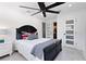 Charming bedroom with ensuite bathroom and ceiling fan at 2599 W Bay Isle Se Dr, St Petersburg, FL 33705
