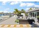 Spacious patio overlooking the water; includes seating and dining areas at 2599 W Bay Isle Se Dr, St Petersburg, FL 33705