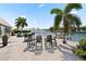 Backyard patio with seating area overlooking the canal at 2599 W Bay Isle Se Dr, St Petersburg, FL 33705