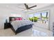 Bright bedroom with water views, a king-size bed, and stylish furnishings at 2599 W Bay Isle Se Dr, St Petersburg, FL 33705