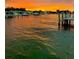 Stunning sunset over calm water with boats and docks at 2599 W Bay Isle Se Dr, St Petersburg, FL 33705