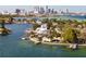 Aerial view of waterfront homes with city skyline in background at 2599 W Bay Isle Se Dr, St Petersburg, FL 33705