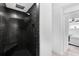 Large walk-in shower with black tile and built-in seat at 2599 W Bay Isle Se Dr, St Petersburg, FL 33705