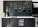Modern kitchen with beverage fridge and dark cabinetry at 2599 W Bay Isle Se Dr, St Petersburg, FL 33705