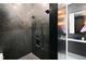 Spacious shower with black tile and rainfall showerhead at 2599 W Bay Isle Se Dr, St Petersburg, FL 33705