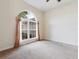 Bedroom with neutral carpet, large window, and ceiling fan at 3027 Aldoro Ave, Spring Hill, FL 34609