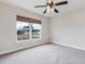 Spacious bedroom with window, ceiling fan and carpeted floors at 3027 Aldoro Ave, Spring Hill, FL 34609