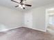 Spacious bedroom with carpeted floor, double doors closet and hallway view at 3027 Aldoro Ave, Spring Hill, FL 34609