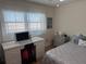 Bright bedroom with a queen bed and home office at 6060 Shore S Blvd # 705, Gulfport, FL 33707