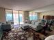 Living room with water views and comfy seating at 6060 Shore S Blvd # 705, Gulfport, FL 33707
