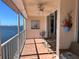 Balcony with seating, ceiling fan, and stunning water views, ideal for enjoying the coastal breeze and scenery at 6060 Shore S Blvd # 705, Gulfport, FL 33707