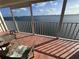 Screened balcony with seating area, offering relaxing outdoor living and a stunning water view at 6060 Shore S Blvd # 705, Gulfport, FL 33707
