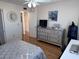 Bedroom with a ceiling fan, dresser, and desk at 6060 Shore S Blvd # 705, Gulfport, FL 33707
