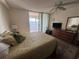 Bedroom with water view, ceiling fan, and dresser at 6060 Shore S Blvd # 705, Gulfport, FL 33707