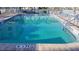 Inviting community pool with ample lounge chairs at 6060 Shore S Blvd # 705, Gulfport, FL 33707