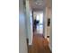 Inviting hallway with hardwood floors leads to a bright living area with water views at 6060 Shore S Blvd # 705, Gulfport, FL 33707