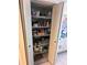 Organized pantry with shelving, stocked with essentials, maximizing storage at 6060 Shore S Blvd # 705, Gulfport, FL 33707
