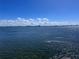 Beautiful waterfront view, blue skies, and fluffy white clouds over calm water at 6060 Shore S Blvd # 705, Gulfport, FL 33707