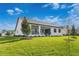 Modern farmhouse style home with covered patio at 6157 Dusk Rose Ln, Brooksville, FL 34601