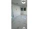 Bright bedroom with mirrored closet doors and marble-look flooring at 6403 Amundson St, Tampa, FL 33634