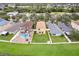 Aerial view of a house with a pool in a residential neighborhood at 7819 Carriage Pointe Dr, Gibsonton, FL 33534