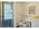 Bathroom with shower, toilet, and pedestal sink at 1718 1St N St, St Petersburg, FL 33704