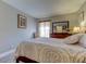 Well-lit bedroom featuring a comfortable queen-size bed and ample space at 1799 N Highland Ave # 7, Clearwater, FL 33755