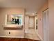 Tiled entryway with kitchen pass-through and closet at 2004 Westley Ct, Safety Harbor, FL 34695