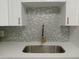 Modern kitchen sink with a gold faucet and white quartz countertop at 2071 Australia W Way # 27, Clearwater, FL 33763