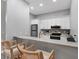 Kitchen with white cabinets and breakfast bar at 2403 Nantucket Green Ct # 0, Sun City Center, FL 33573
