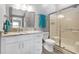 Updated bathroom with granite countertop, white vanity, and walk-in shower at 2403 Nantucket Green Ct # 0, Sun City Center, FL 33573