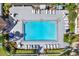 Aerial view of refreshing community pool and surrounding patio at 2403 Nantucket Green Ct # 0, Sun City Center, FL 33573
