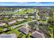 Aerial view of community with golf course and lake at 2403 Nantucket Green Ct # 0, Sun City Center, FL 33573