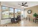 Bright sunroom with desk, chair, and view of backyard at 2403 Nantucket Green Ct # 0, Sun City Center, FL 33573