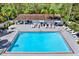Inviting community pool with lounge chairs and patio area at 2403 Nantucket Green Ct # 0, Sun City Center, FL 33573