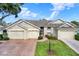 Front view of charming two-story home with attached garage at 2403 Nantucket Green Ct # 0, Sun City Center, FL 33573