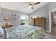 Spacious bedroom with large window, ceiling fan, and ample dresser storage at 2403 Nantucket Green Ct # 0, Sun City Center, FL 33573