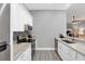 Modern kitchen with white cabinets, granite countertops, and stainless steel appliances at 2403 Nantucket Green Ct # 0, Sun City Center, FL 33573