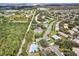 Aerial view of community, roads, and a pool at 2403 Nantucket Green Ct # 0, Sun City Center, FL 33573