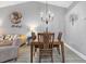 Dining area with chandelier and wood table at 2403 Nantucket Green Ct # 0, Sun City Center, FL 33573