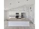 Modern kitchen with island and stainless steel appliances at 2452 Nantucket Ter, North Port, FL 34286