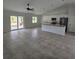 Open living area with tile flooring and sliding glass doors at 2452 Nantucket Ter, North Port, FL 34286